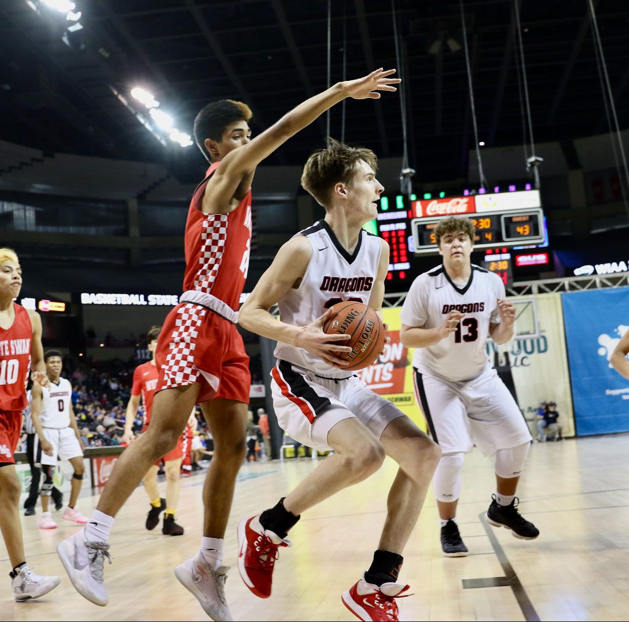 Saint George’s basketball player drives to the basket