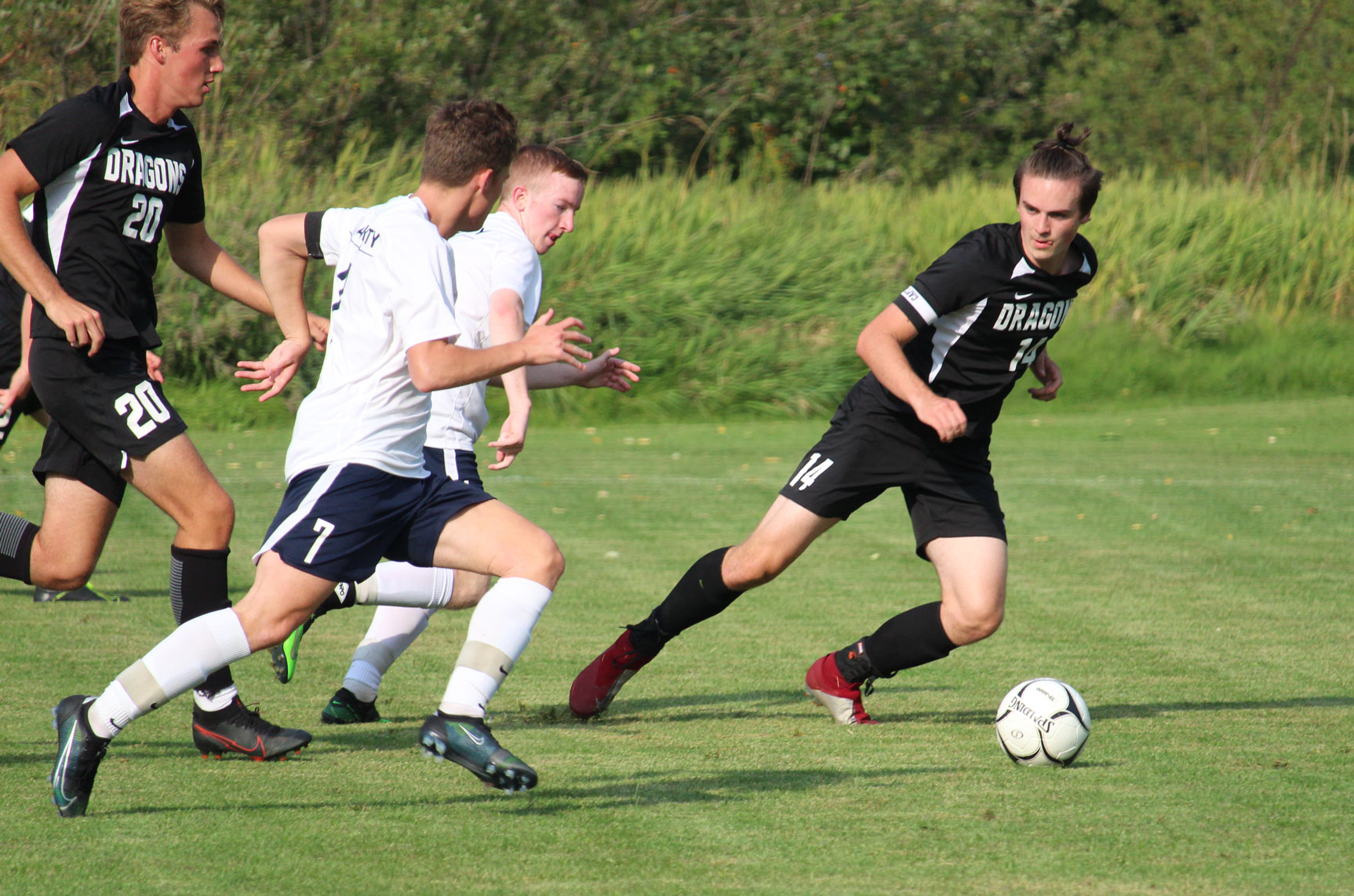 SGS soccer players in action on the field